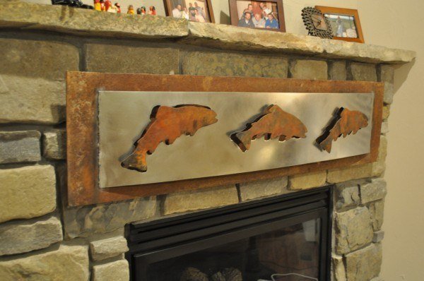plasma cut art on fireplace surround